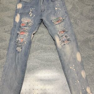 Trendy Ripped Jeans with Paint Accents
